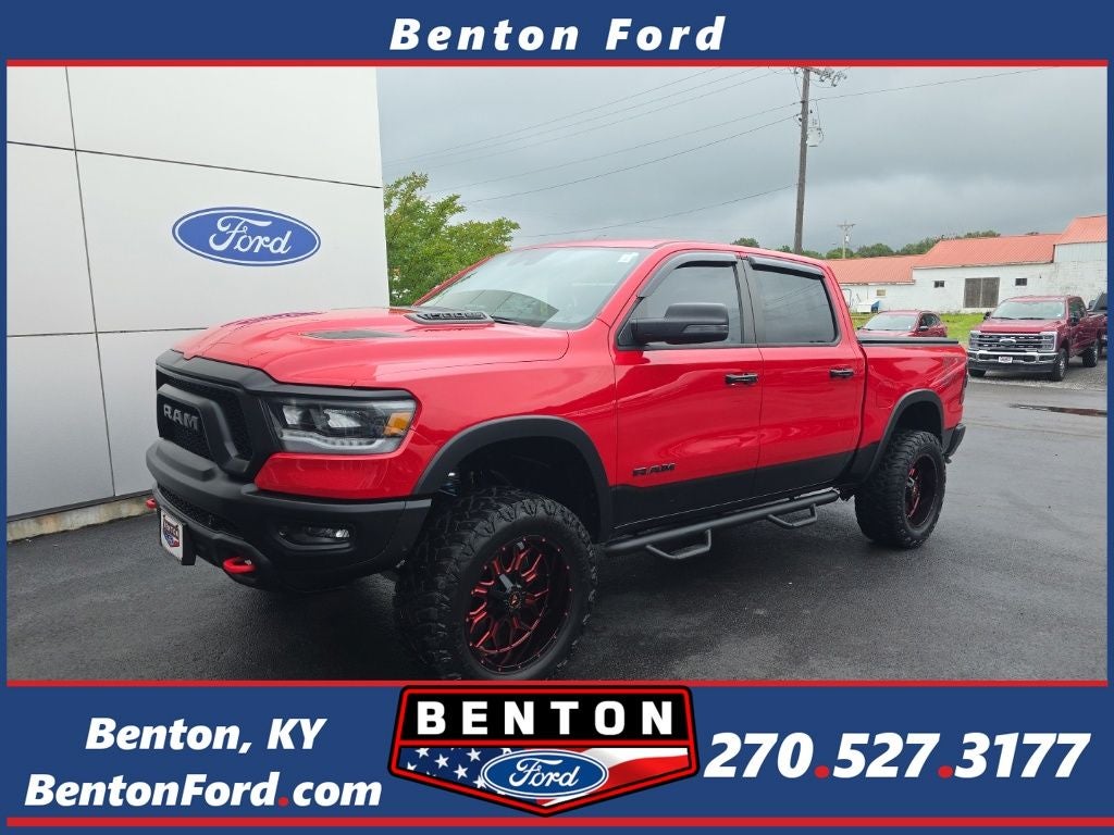 2023 RAM 1500 Rebel in Flame Red Clearcoat — front three-quarter view